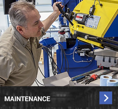 man repairing machine tool system